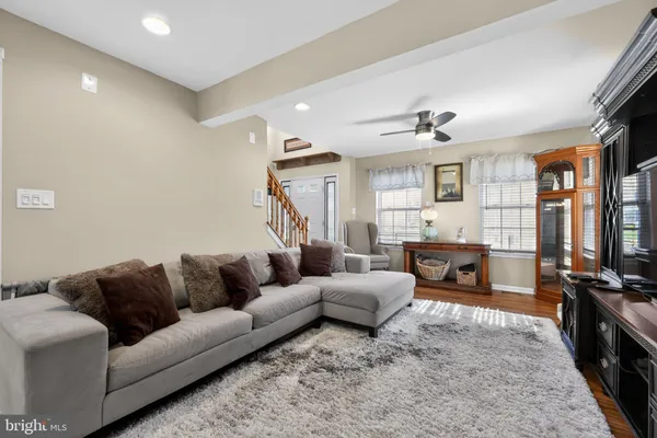 a living room with furniture flat screen tv and a fireplace