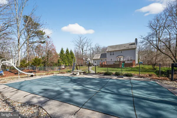 a view of a playground with basketball court