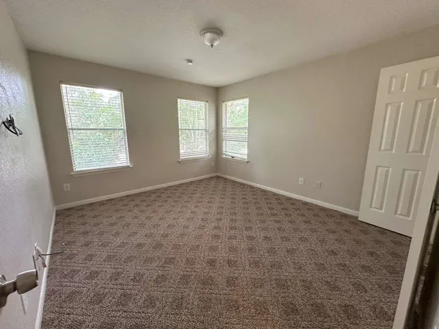 a big room with windows and closet