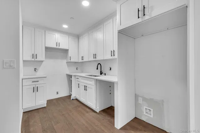 a spacious bathroom with a sink and a stove