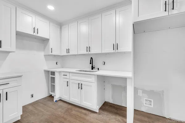a view of cabinets a sink and dishwasher in a kitchen