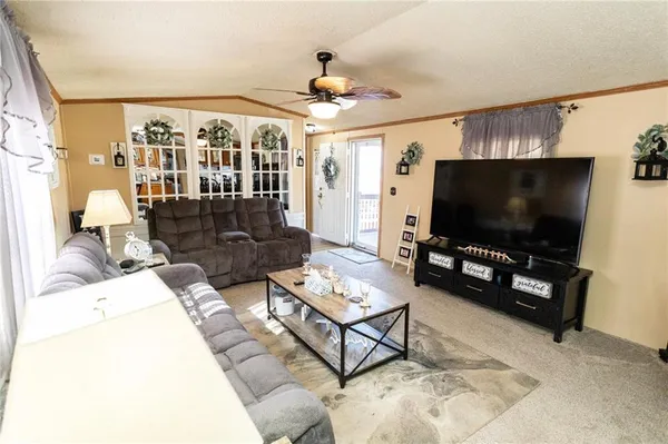 a kitchen with stainless steel appliances granite countertop a stove a sink dishwasher and a refrigerator