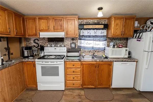 a room with wooden floors and furniture