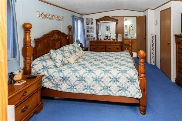 a spacious bathroom with a sink a mirror and a shower