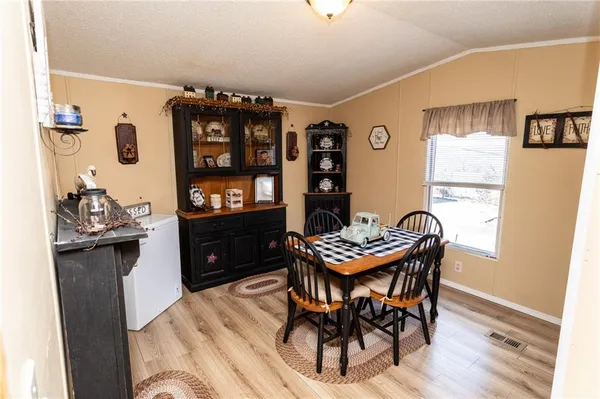 a kitchen with a table and chairs