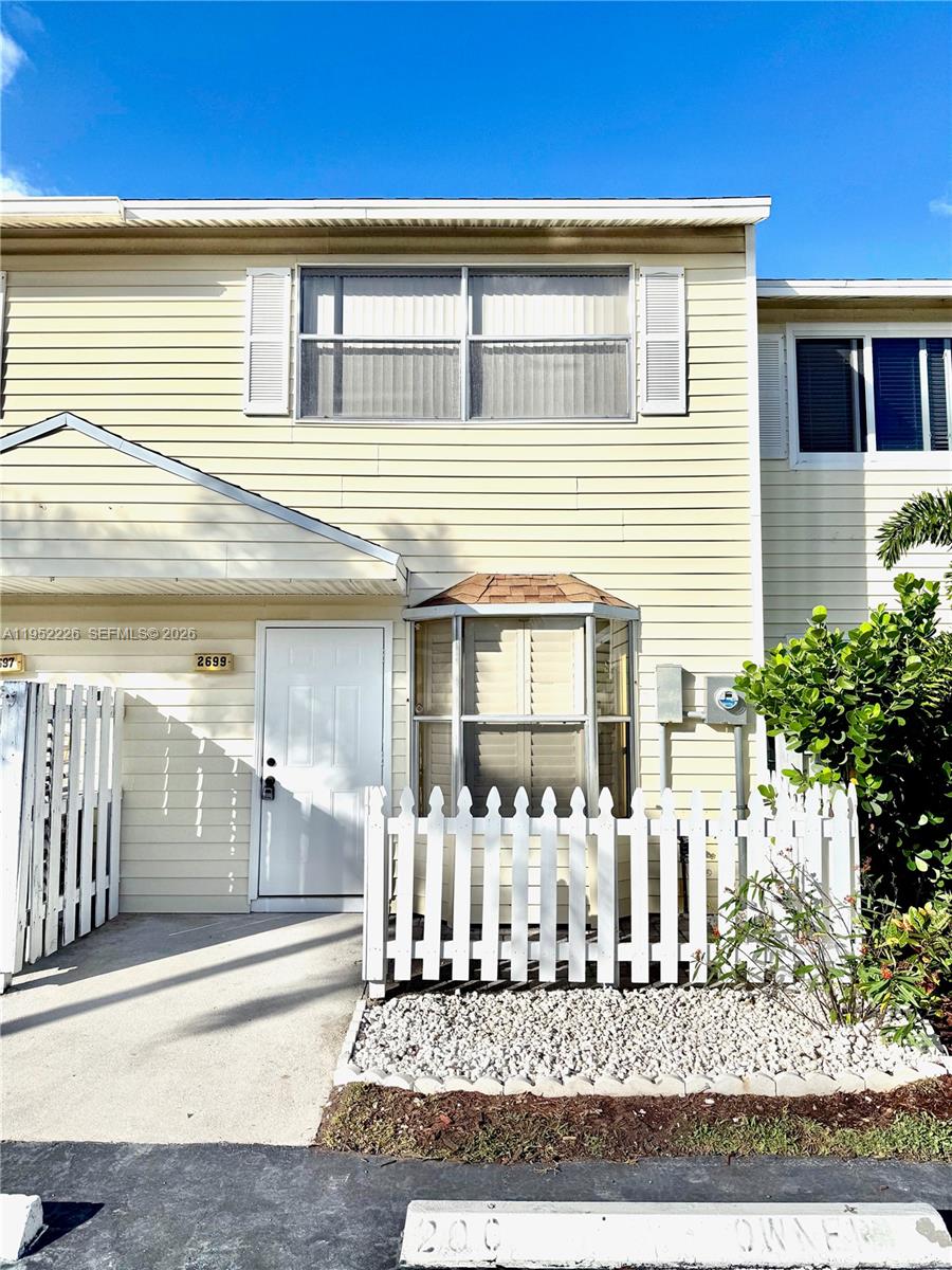 2699 Northeast 15th Street Pompano Beach, FL 33062 - Photo 1 of 29 a front view of a house with lots of yellow lighting