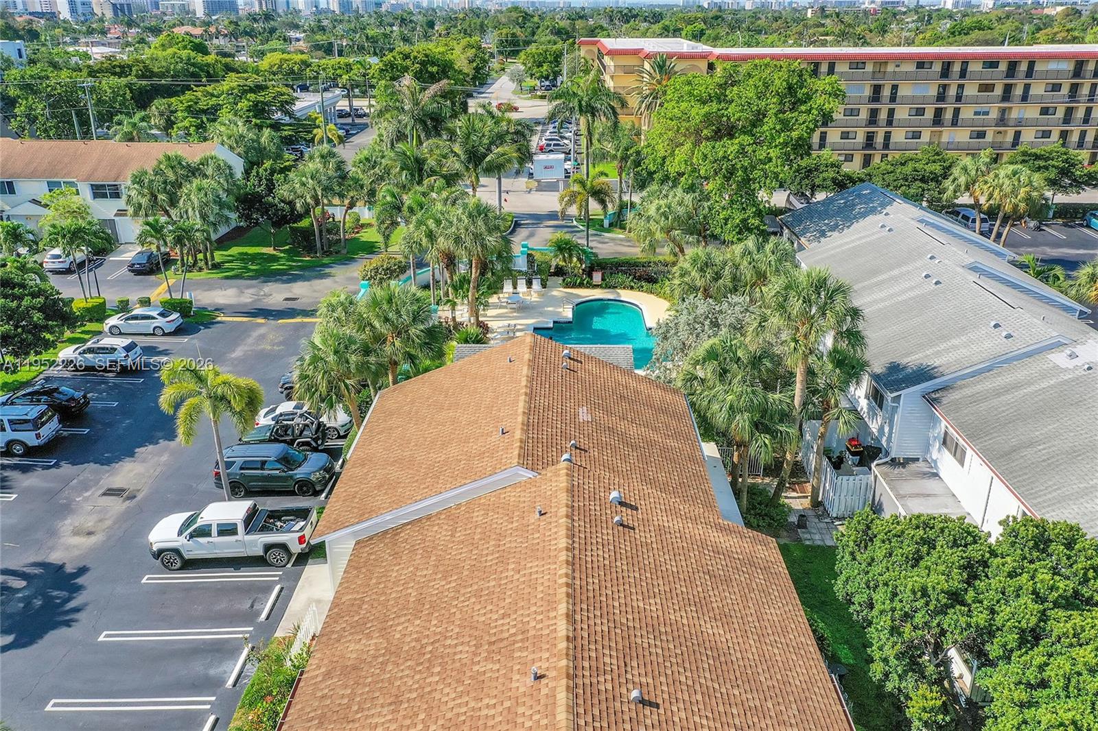 2699 Northeast 15th Street Pompano Beach, FL 33062 - Photo 21 of 29 an aerial view of a house with a yard and lake view