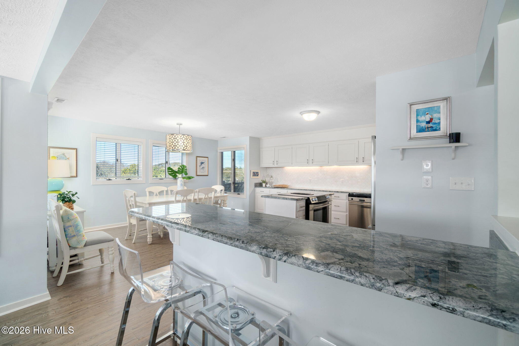 301 Salter Path Road, Unit 2 GENESIS Pine Knoll Shores, NC 28512 - Photo 19 of 54 Snack Bar overlooking Kitchen