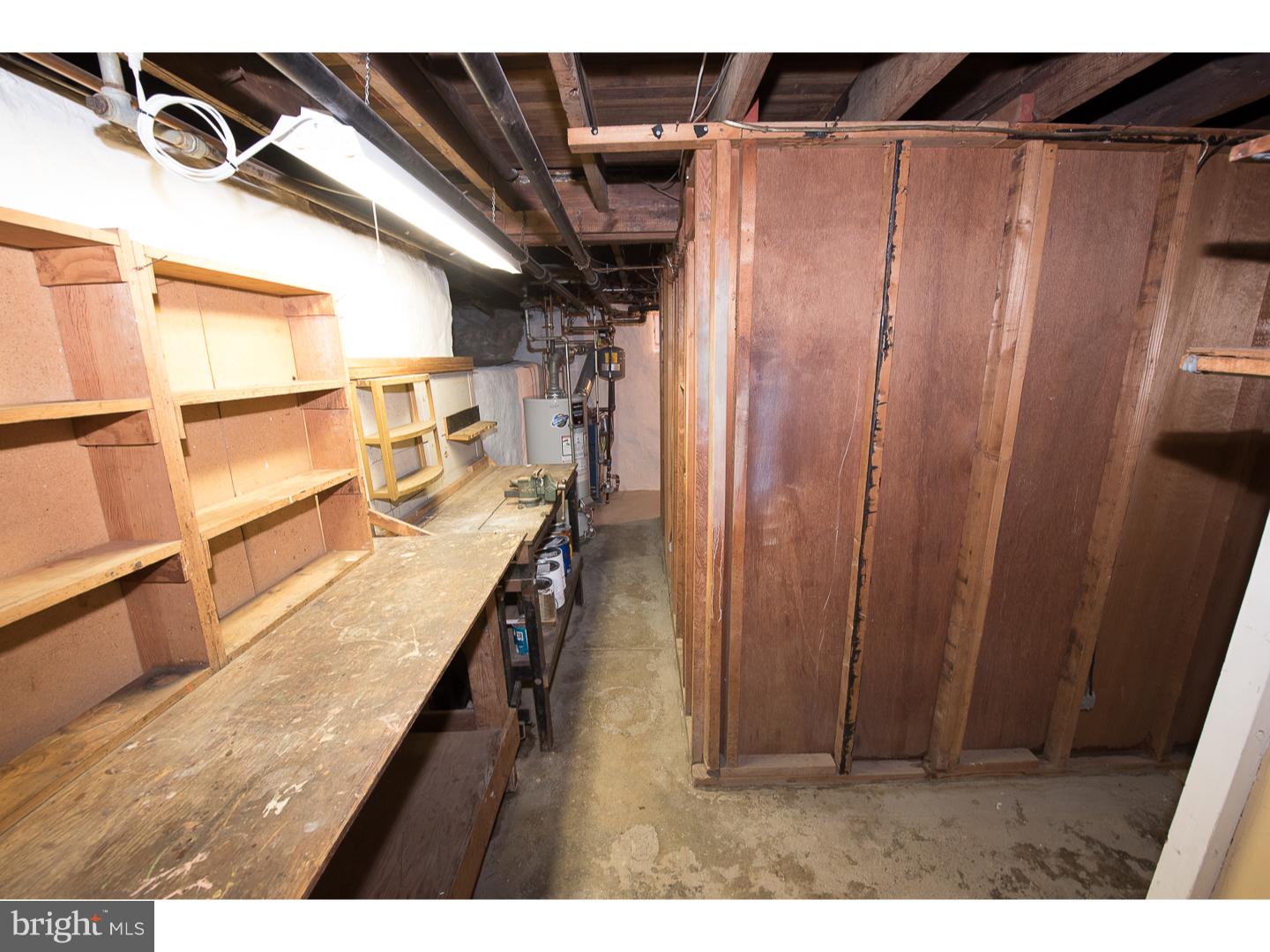 238 Strathmore Road Havertown, PA 19083 - Photo 22 of 25 a kitchen with a refrigerator and a wooden fence