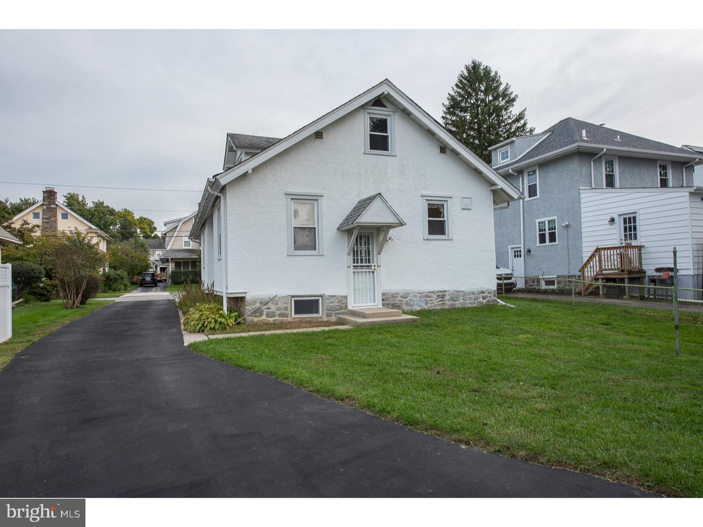 238 Strathmore Road Havertown, PA 19083 - Photo 23 of 25 a front view of house with yard and green space