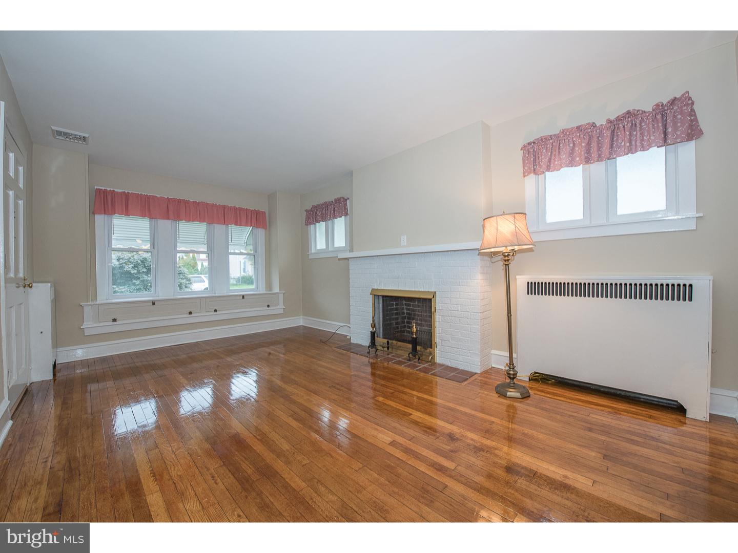 238 Strathmore Road Havertown, PA 19083 - Photo 5 of 25 a view of empty room with wooden floor and fan