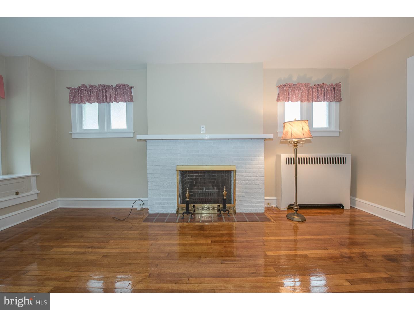 238 Strathmore Road Havertown, PA 19083 - Photo 6 of 25 a living room with a fireplace
