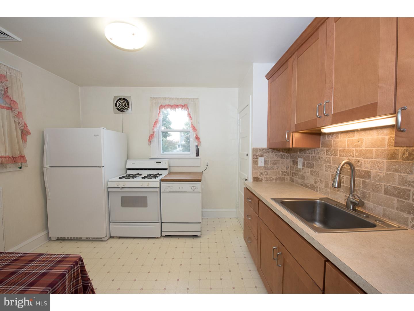 238 Strathmore Road Havertown, PA 19083 - Photo 10 of 25 a kitchen with a sink stove and refrigerator