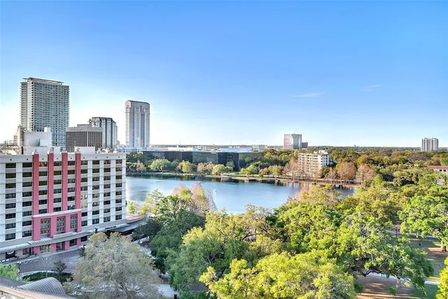a view of a livingroom with furniture and a kitchen