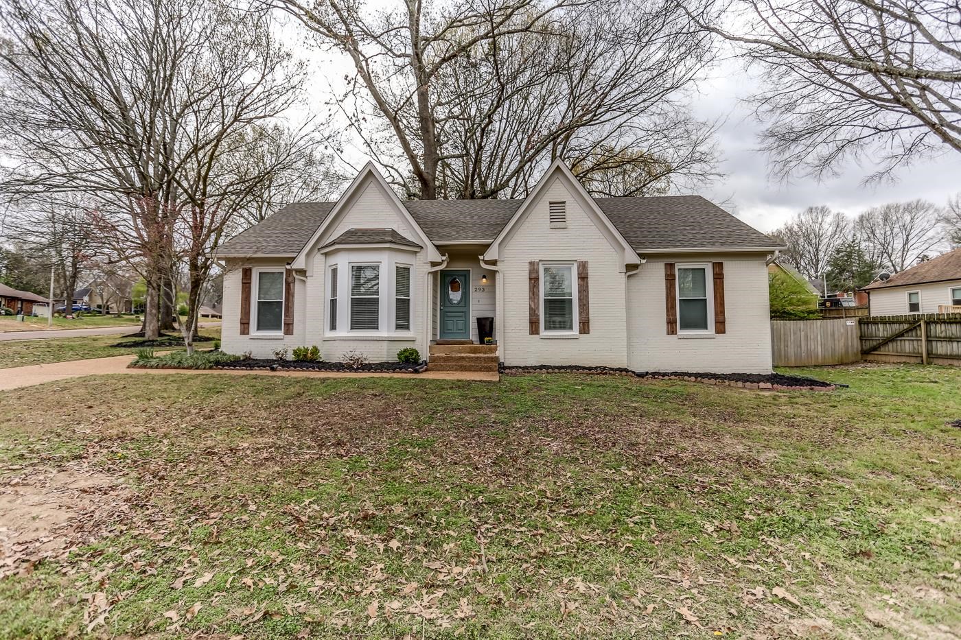 293 Glen Echo Road Collierville, TN 38017 - Photo 1 of 33 a front view of a house with a garden