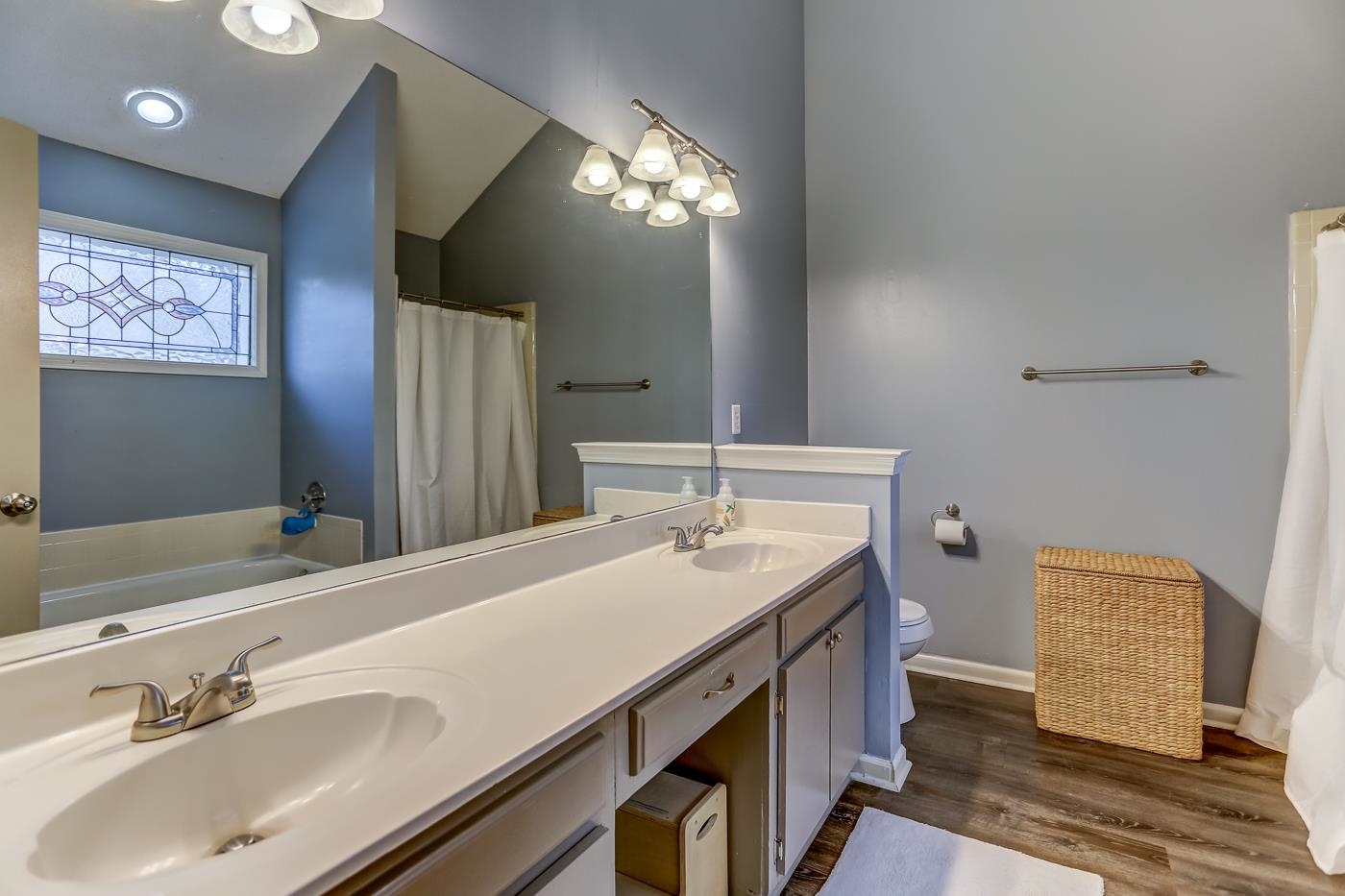 293 Glen Echo Road Collierville, TN 38017 - Photo 18 of 33 a bathroom with a sink and a mirror