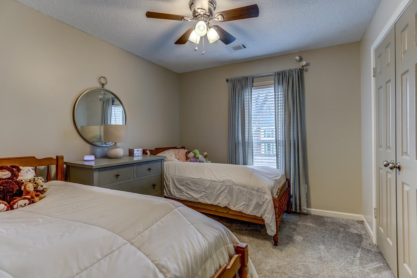 293 Glen Echo Road Collierville, TN 38017 - Photo 20 of 33 a bedroom with two beds and a chandelier