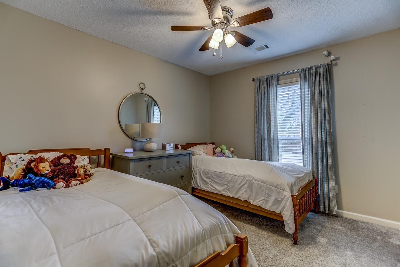 293 Glen Echo Road Collierville, TN 38017 - Photo 21 of 33 a bedroom with two beds and a chandelier