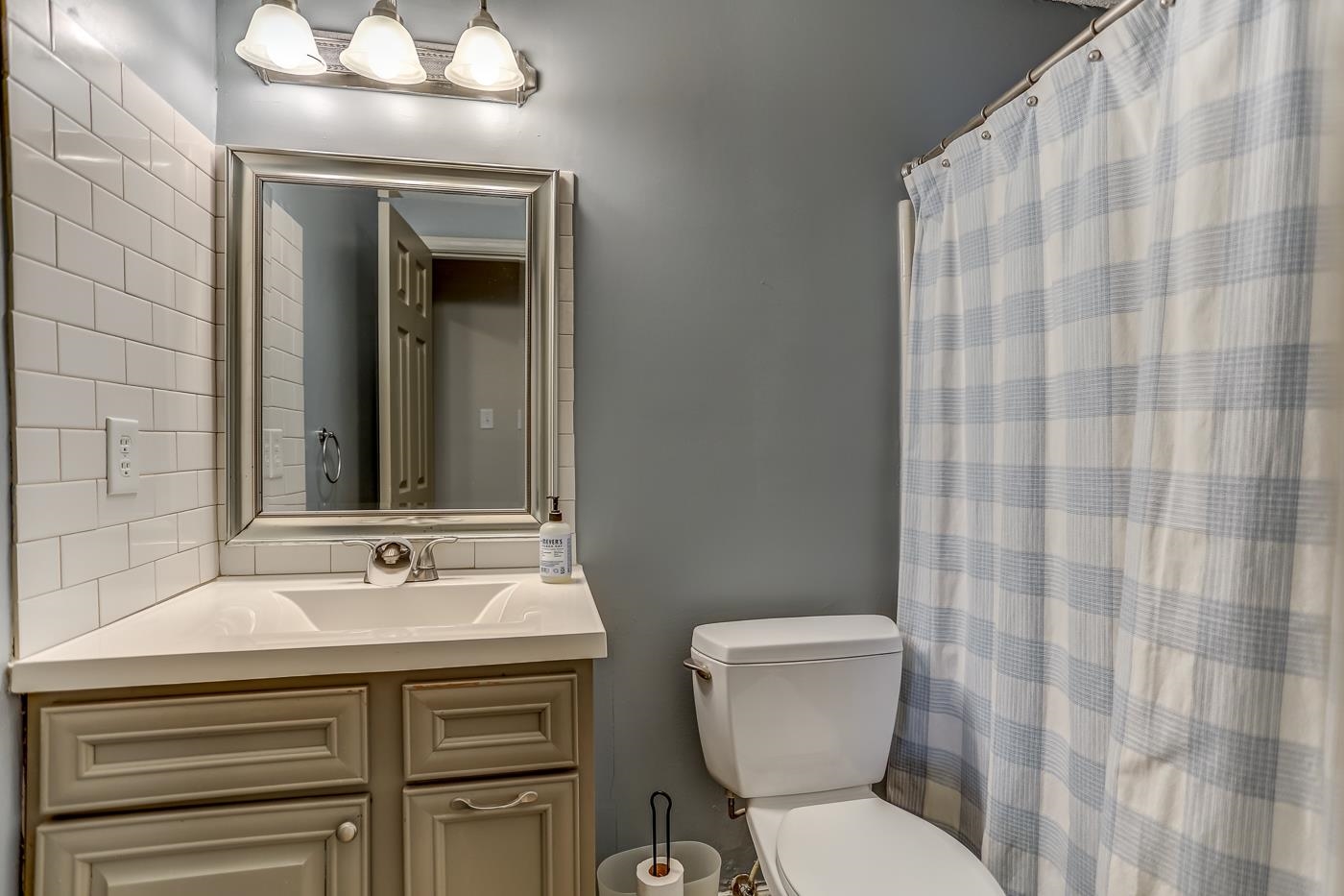 293 Glen Echo Road Collierville, TN 38017 - Photo 24 of 33 a bathroom with a sink toilet and mirror