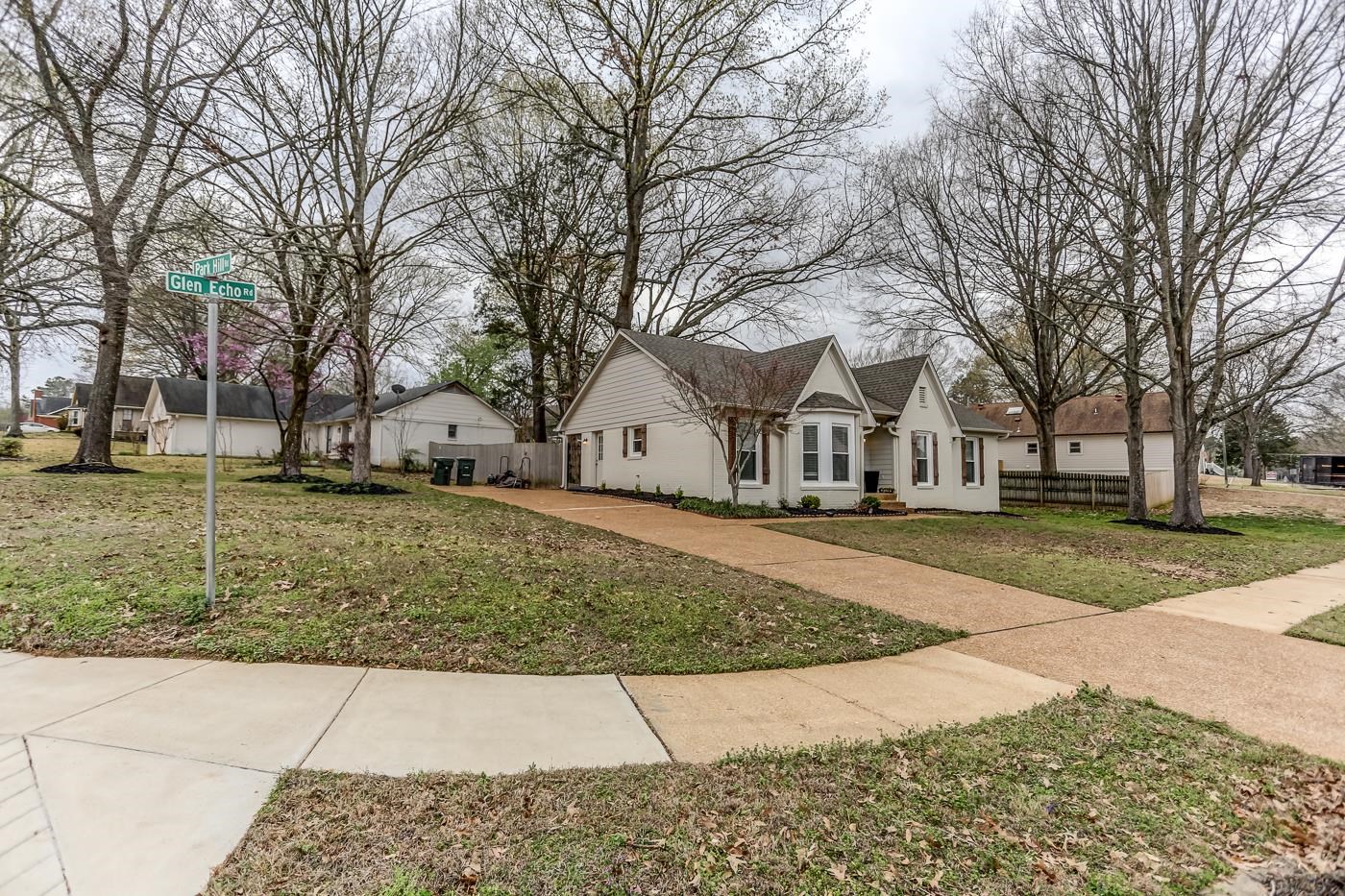 293 Glen Echo Road Collierville, TN 38017 - Photo 31 of 33 a view of a white house with a yard covered with snow