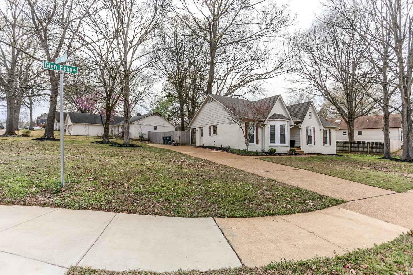 293 Glen Echo Road Collierville, TN 38017 - Photo 32 of 33 a view of white house with a yard covered with snow