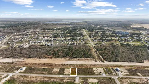 an aerial view of residential building and trees