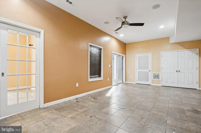a view of a house with a large tree