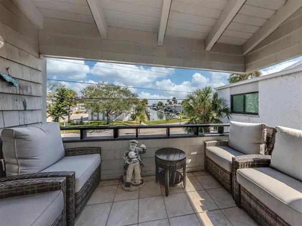 a outdoor living space with furniture and a flat screen tv