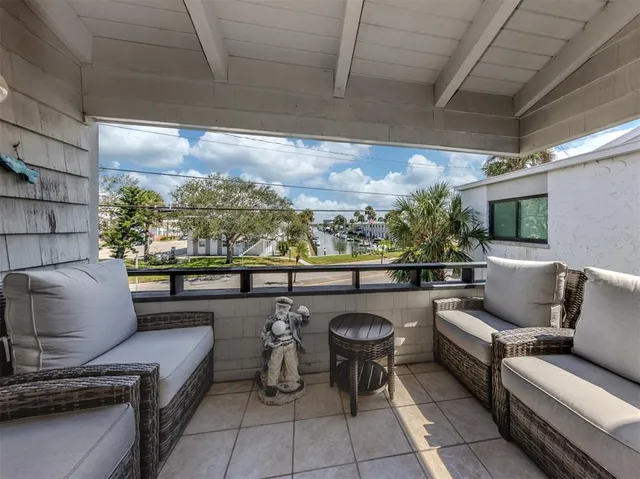 a outdoor living space with furniture and a flat screen tv