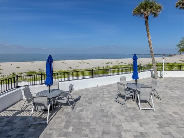 a view of a patio with a table chairs and a patio