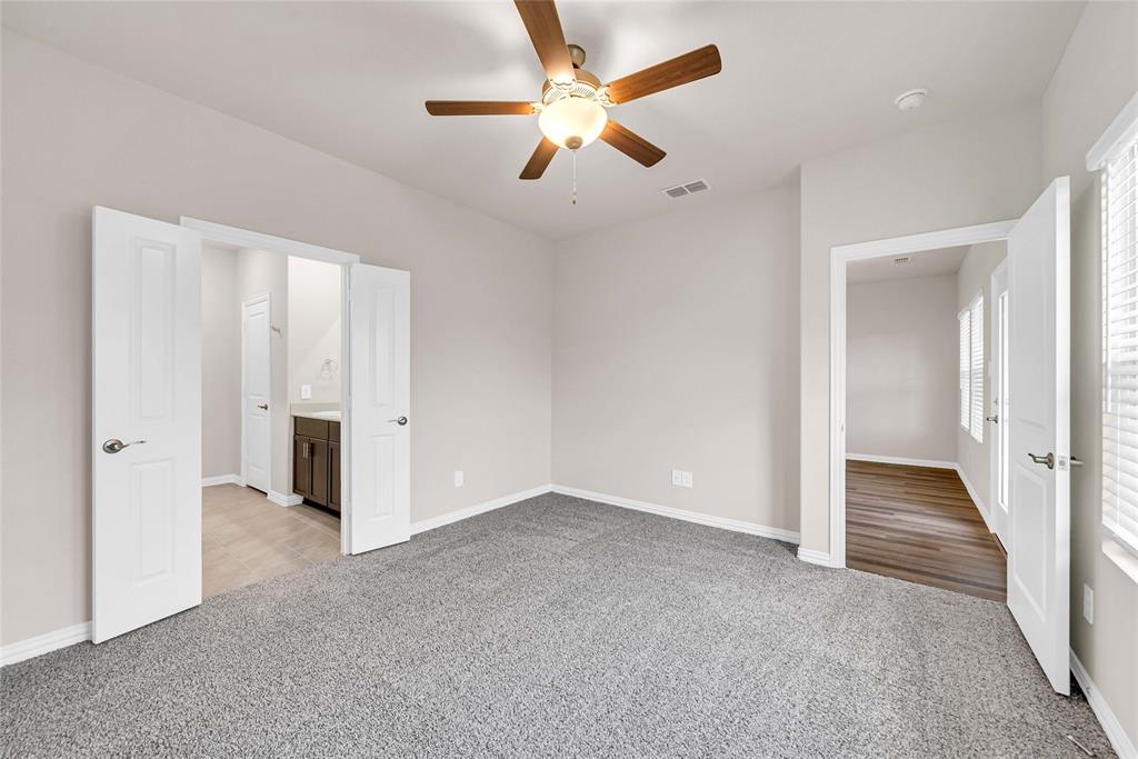 504 Weller Road Lowry Crossing, TX 75069 - Photo 18 of 32 an empty room with closet and a ceiling fan