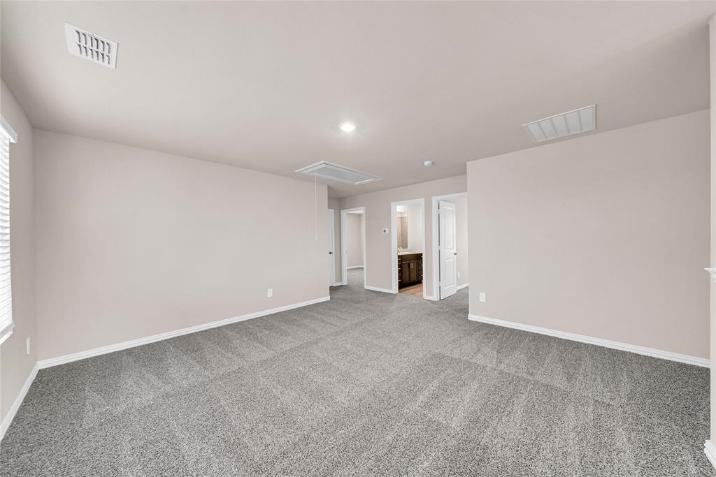 504 Weller Road Lowry Crossing, TX 75069 - Photo 22 of 32 a view of an empty room with a kitchen