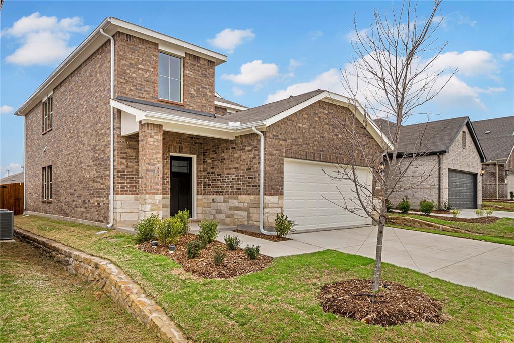 504 Weller Road Lowry Crossing, TX 75069 - Photo 3 of 32 a front view of a house with garden