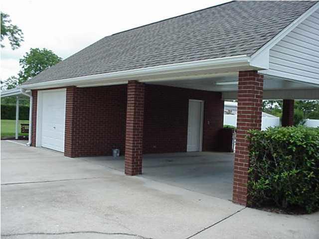 2442 Tate Road Cantonment, FL 32533 - Photo 12 of 15 Two car carport, one car garage/workshop and third one car carport. Storage over the entire area above the carport.