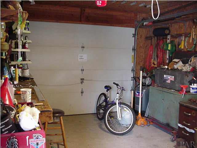 2442 Tate Road Cantonment, FL 32533 - Photo 14 of 15 Workshop/one car garage with electricity, work benches, 220 volt.