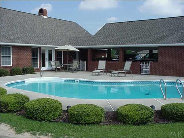 2442 Tate Road Cantonment, FL 32533 - Photo 2 of 15 Beautiful inground pool enclosed with while vinyl privacy fence.