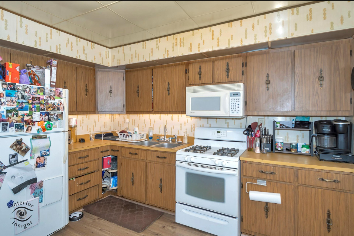 202 MacGregor Road Lockport, IL 60441 - Photo 5 of 26 a kitchen with kitchen island a stove a sink and cabinets