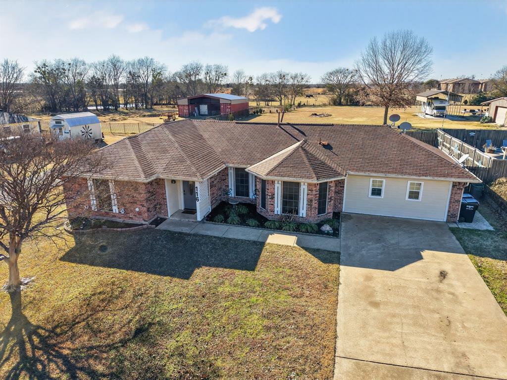 a view of multiple houses with a yard