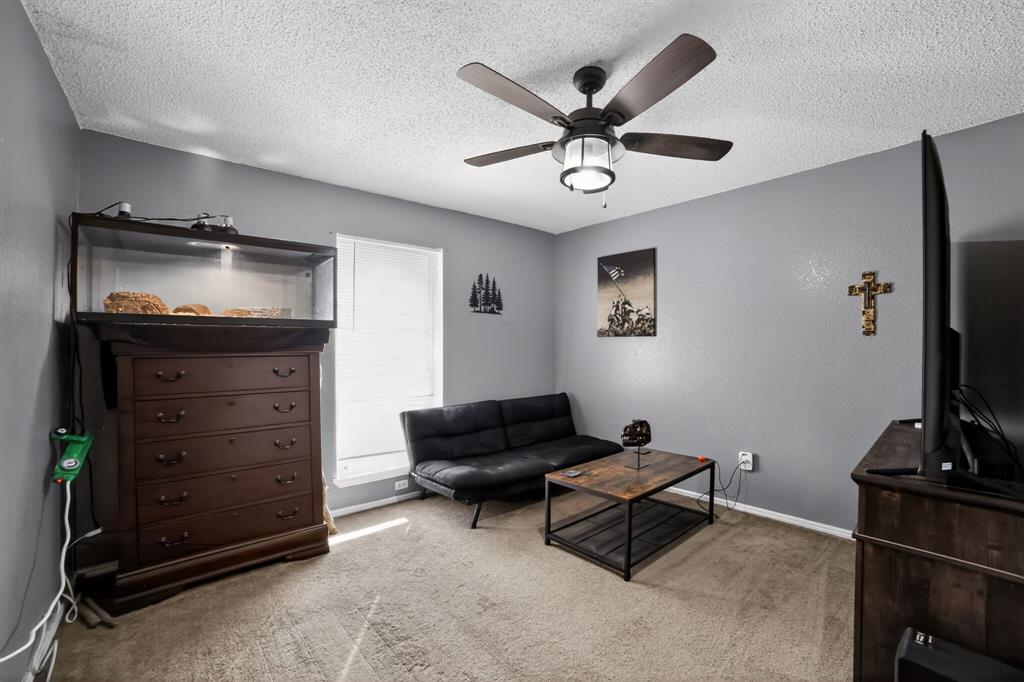 116 Curtis Lane Quinlan, TX 75474 - Photo 12 of 31 a living room with furniture and a flat screen tv