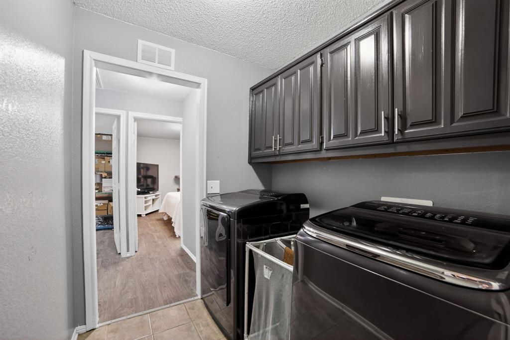 116 Curtis Lane Quinlan, TX 75474 - Photo 19 of 31 a kitchen with a stove and a cabinet