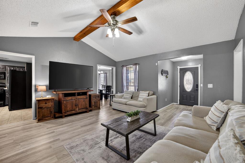 116 Curtis Lane Quinlan, TX 75474 - Photo 5 of 31 a living room with furniture and a flat screen tv
