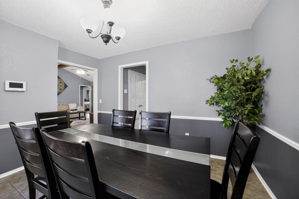 116 Curtis Lane Quinlan, TX 75474 - Photo 6 of 31 a dining room with furniture and potted plants