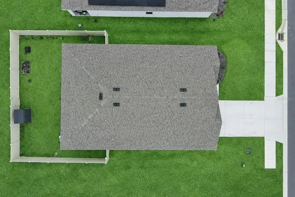 an aerial view of a house with a garden