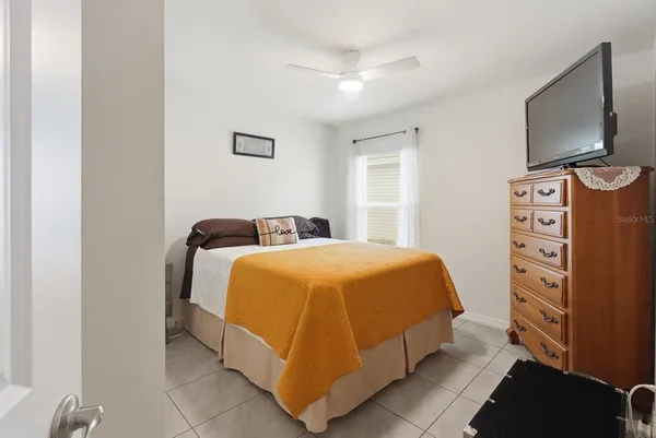 a livingroom with workspace and a couch