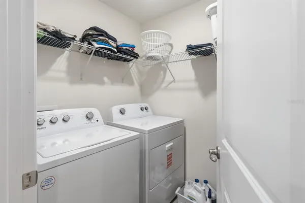 a kitchen that has a lot of cabinets a sink and a stove in it