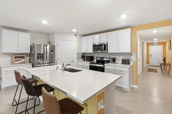 a view of a dining room with furniture and a window