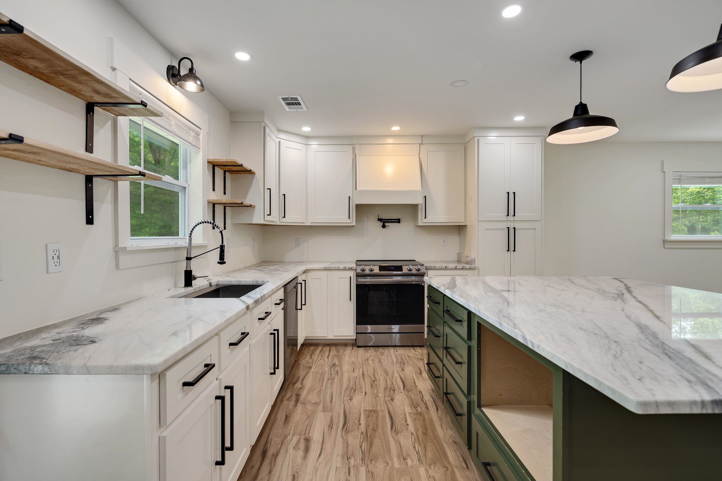 240 Dogwood Road Somerville, TN 38068 - Photo 11 of 37 a kitchen with a sink stove and cabinets