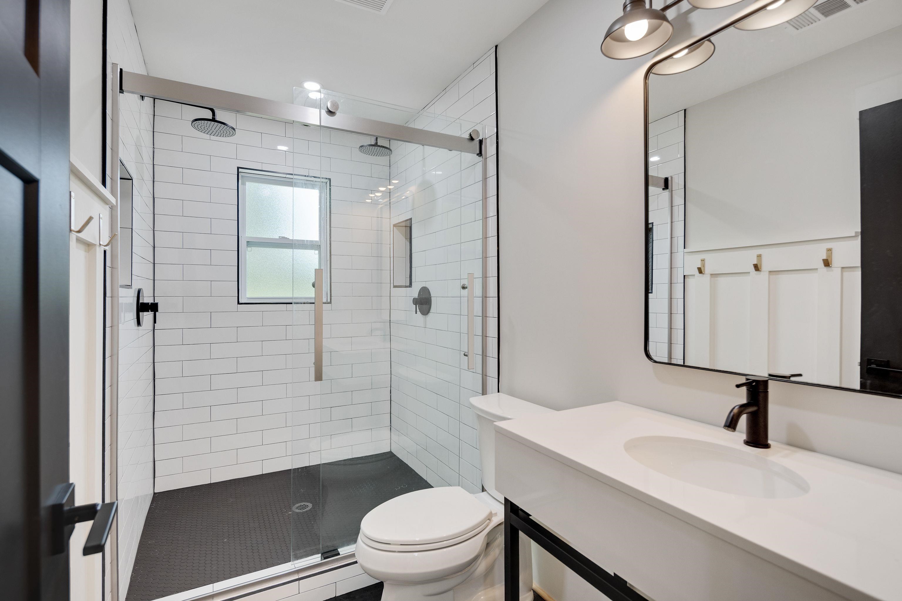 240 Dogwood Road Somerville, TN 38068 - Photo 23 of 37 a bathroom with a sink toilet a mirror and shower