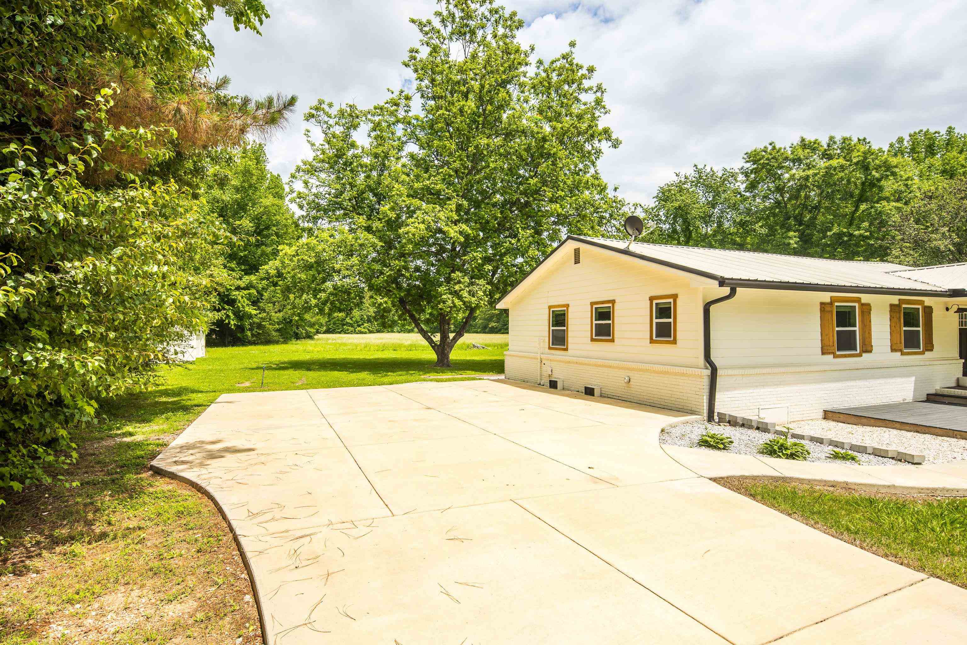 240 Dogwood Road Somerville, TN 38068 - Photo 26 of 37 a view of house with backyard and trees