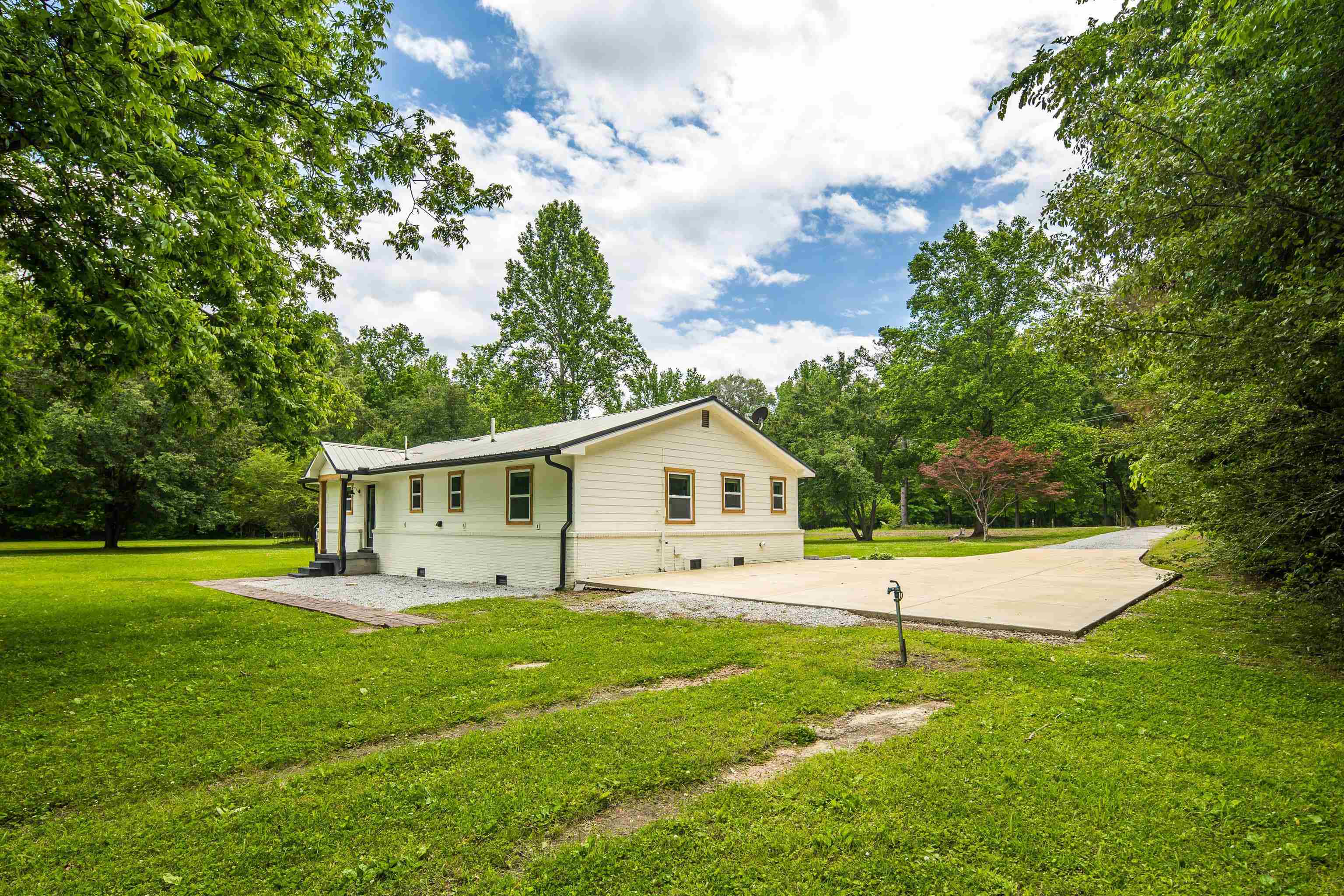 240 Dogwood Road Somerville, TN 38068 - Photo 27 of 37 a view of a house with a backyard and a tree